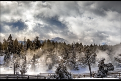 Mammoth Springs - Snow, Steam and Clouds by Kevin Blake